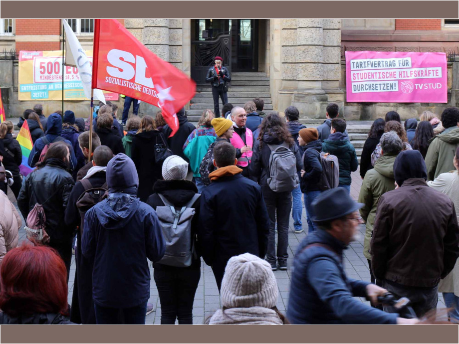 Wissenschaftliche Mitarbeiter/innen und Studentische Hilfskräfte der Uni Darmstadt am Hochschulaktionstag Wissenschaftliche Mitarbeiter/innen und Studentische Hilfskräfte der Uni Darmstadt am Hochschulaktionstag
